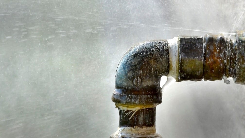 pipe leak spraying out water